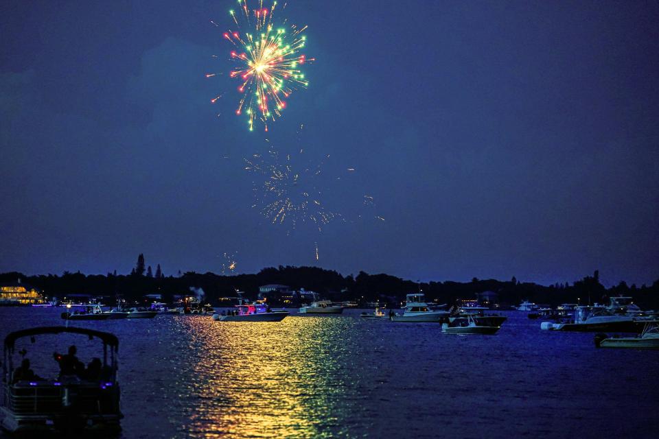 Boats of all sizes gather to watch the fireworks display at Fireworks on the 4th: Red, White and Boom on Sunday, July 04, 2021, in downtown Stuart. The July 4th celebration had live music on the Riverwalk Stage and fireworks at Flagler Park. 