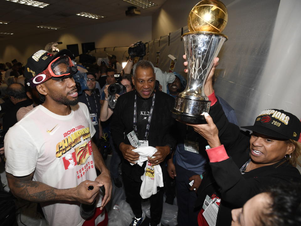 Toronto Raptors forward Kawhi Leonard, left, and his mother, Kim Robertson, celebrate after the Raptors' 114-110 win over the Golden State Warriors in Game 6 of basketball’s NBA Finals, Thursday, June 13, 2019, in Oakland, Calif. (Frank Gunn/The Canadian Press via AP)