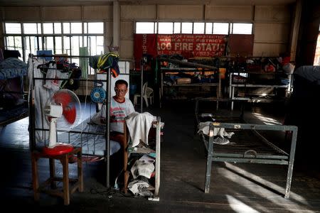 Firefighter Milan Miranda rests at Paco Fire Station in Paco, Manila, Philippines, May 4, 2018. Miranda is set to retire next year after battling blazes for 32 years. He said he was inspired by his father and uncle to join the ranks, despite the dangers. "Every fire is a challenge, especially when we lack equipment like breathing apparatus so we inhale smoke and endure the heat, risking our health and lives," Miranda said. "But this is the career given to me by God." REUTERS/Erik De Castro