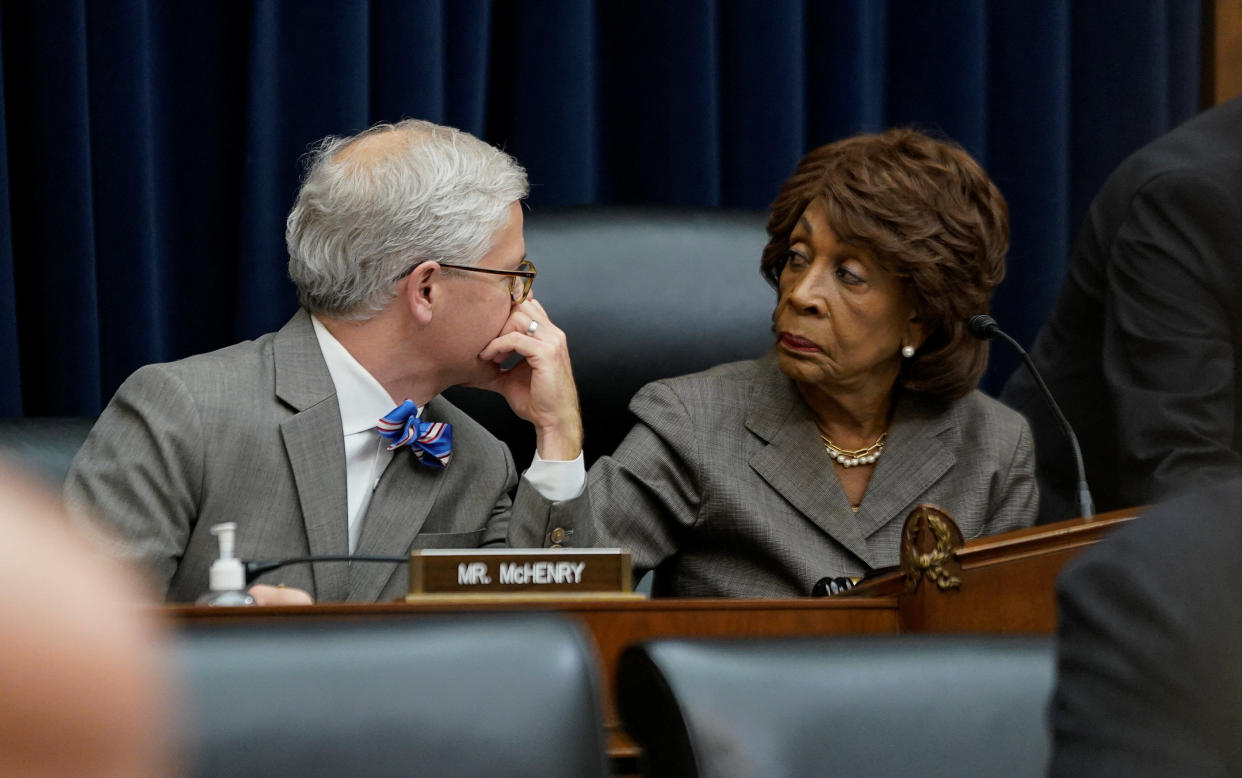 Republican ranking member of the Committee U.S. Rep. Patrick McHenry (R-NC) and House Financial Services Committee Chair Rep. Maxine Waters (D-CA) talk before the start of FTX Group CEO John J. Ray III's (not pictured) testimony, at a U.S. House Financial Services Committee hearing investigating the collapse of the now-bankrupt crypto exchange FTX after the arrest of FTX founder Sam Bankman-Fried, on Capitol Hill in Washington, U.S. December 13, 2022. REUTERS/ Elizabeth Frantz
