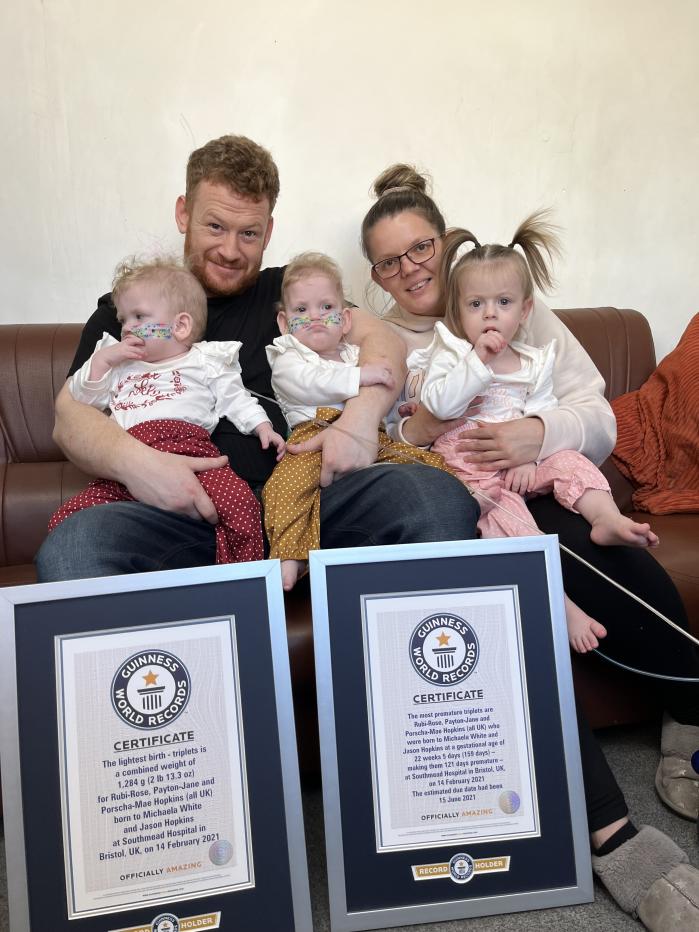 Rubi-Rose, Payton Jane and Porscha-Mae Hopkins pictured with parents Jason Hopkins and Michaela White with the Guinness World Records (Guinness World Records)