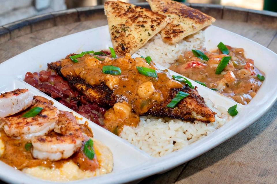 Crawfish etouffee, shrimp-and-grits and blackened catfish with Pontchartrain sauce at Rockfish Seafood Grill.