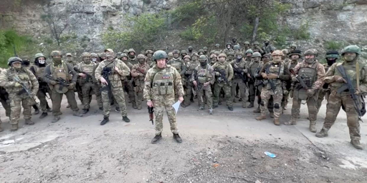 Founder of Wagner private mercenary group Yevgeny Prigozhin makes a statement as he stand next to Wagner fighters in an undisclosed location in the course of Russia-Ukraine conflict, in this still image taken from video released May 5, 2023.