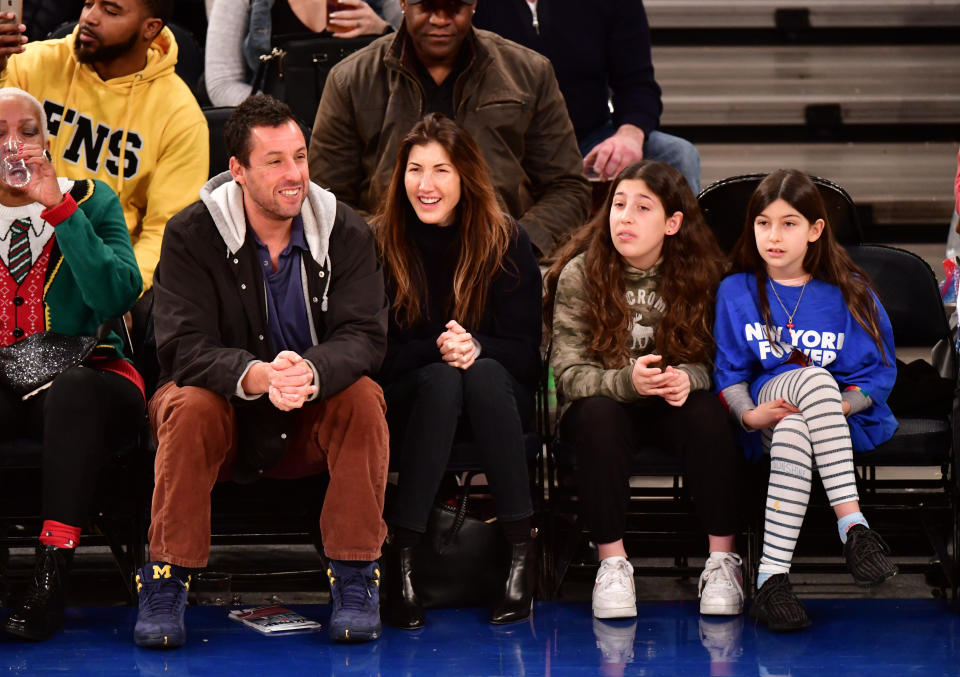 From left: Adam Sandler, Jackie Sandler, Sadie Sandler and Sunny Sandler attend the Milwaukee Bucks vs. New York Knicks game at Madison Square Garden on Dec. 25, 2018, in New York City. (Photo: James Devaney via Getty Images)