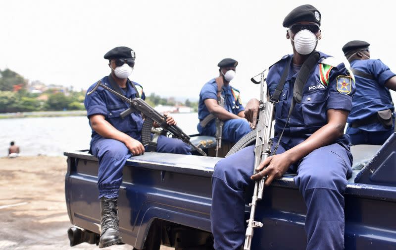 FILE PHOTO: Congolese policemen wear masks as they ride on their patrol pick-up truck amid the coronavirus disease (COVID-19) outbreak in Goma