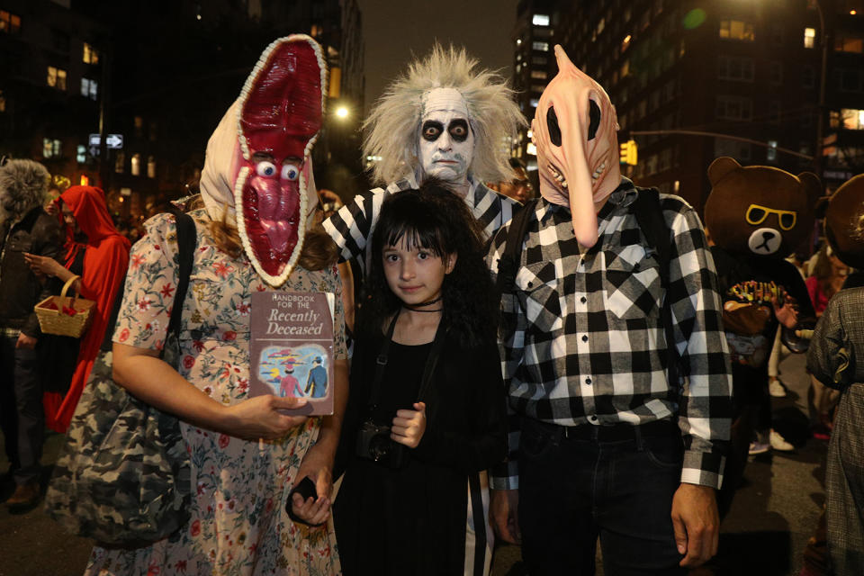 People dressed as characters from movie "Beetlejuice" participate in the Halloween Parade in New York City. (Photo: Gordon Donovan/Yahoo News)