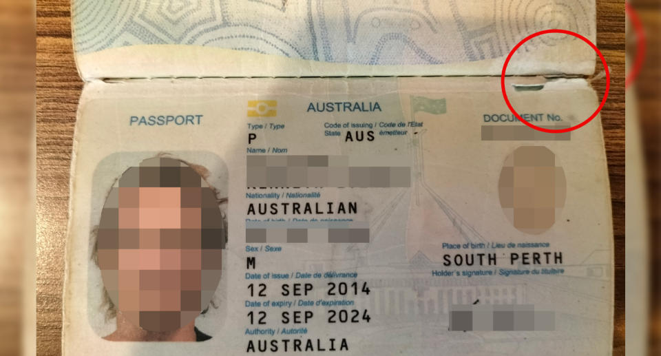 Mike's passport can be seen with the passport detail highlighted by a red circle. 