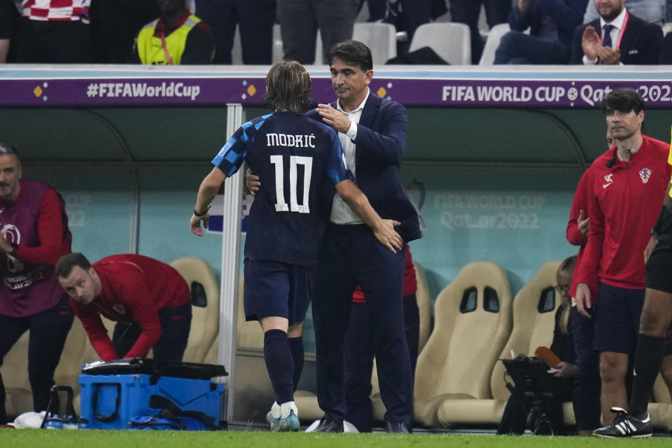 Croatia's Luka Modric lease hugged by head coach Zlatko Dalic as he is substituted during the World Cup semifinal soccer match between Argentina and Croatia at the Lusail Stadium in Lusail, Qatar, Tuesday, Dec. 13, 2022. (AP Photo/Manu Fernandez)