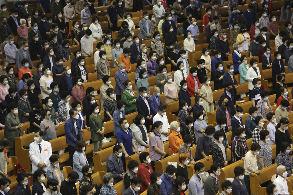 Christians wearing face masks to help protect against the spread of the new coronavirus pray during a service at the Yoido Full Gospel Church in Seoul, South Korea, Sunday, May 31, 2020. (AP Photo/Ahn Young-joon)