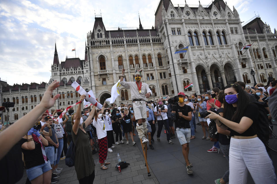 Students of the University of Theatre and Film Arts (SZFE) and their sympathizers form a human chain in protest against changes to the way the university is governed in Budapest, Hungary, Sunday, Sept. 6, 2020. (Marton Monus/MTI via AP)