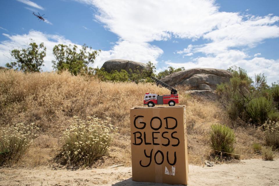 A handmade message intended for firefighters rests on Elder Creek Road during the Bonny Fire near Anza, Calif., on Saturday, July 29, 2023.