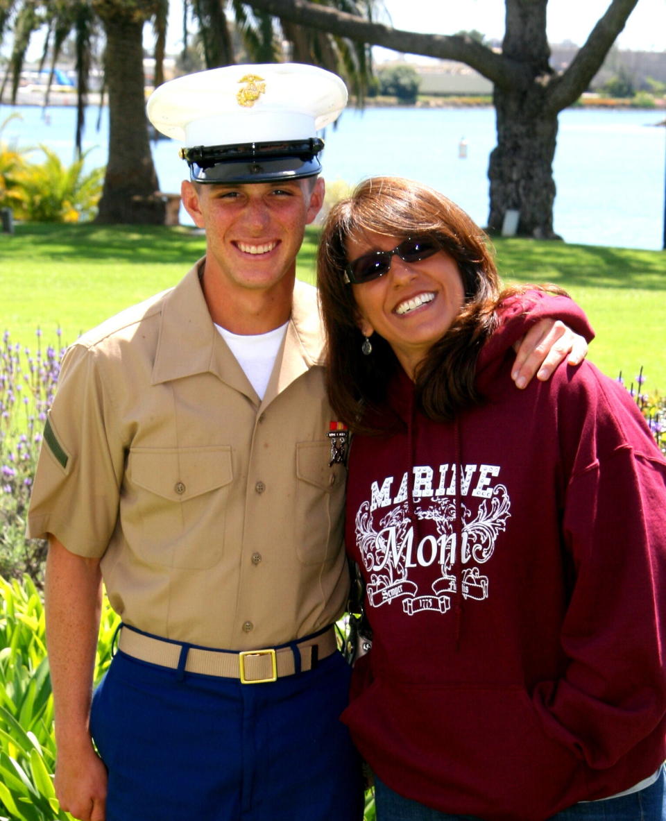 This undated image provided by the Reed family, shows Trevor Reed and his mother Paula Reed. Russia is holding Marine veteran Trevor Reed, who was sentenced to nine years on charges he assaulted a police officer. (Reed Family via AP)