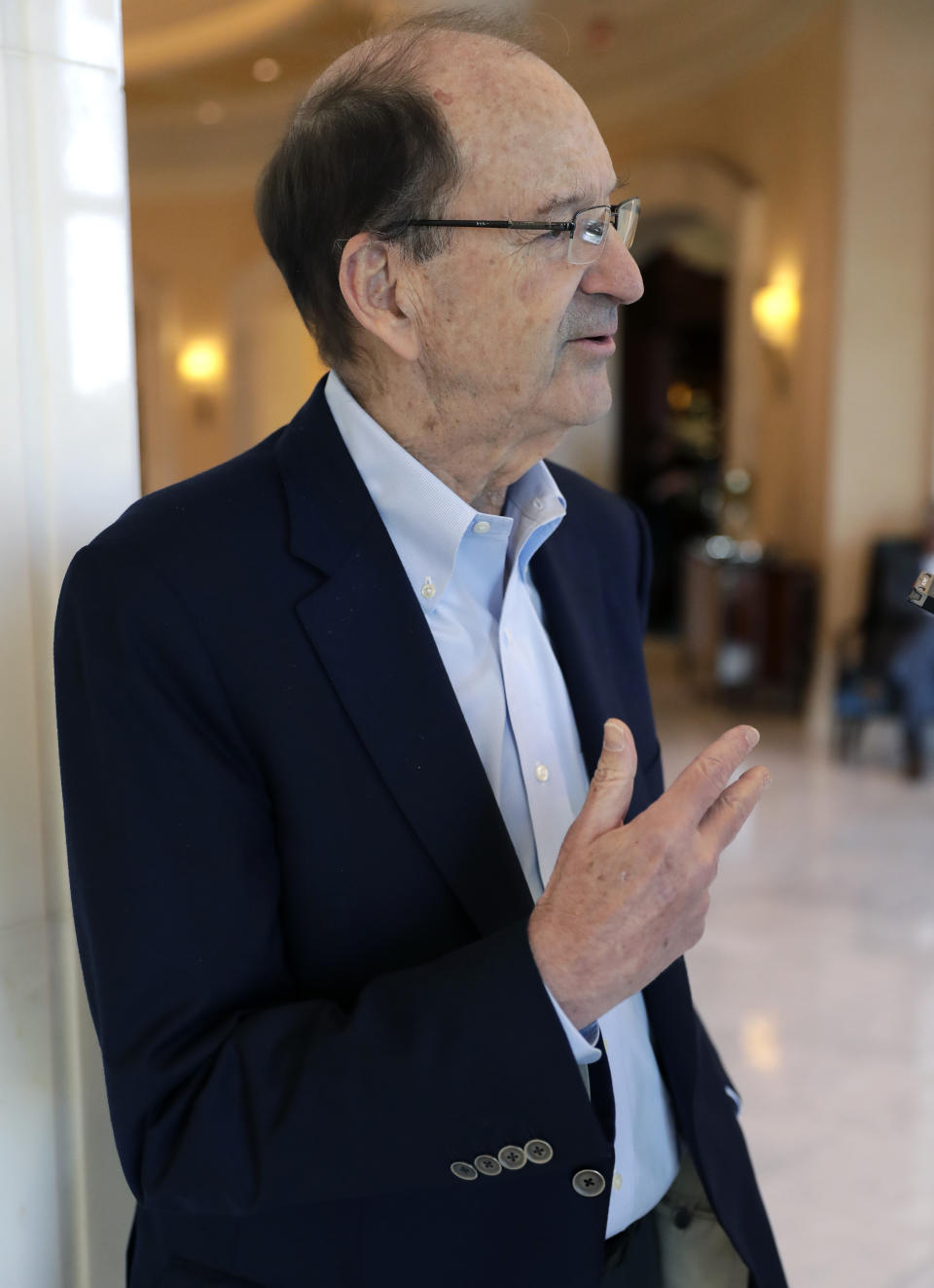 Bill DeWitt Jr., managing partner and chairman of the St. Louis Cardinals, speaks with a reporter at the baseball owners meetings Thursday, Feb. 7, 2019, in Orlando, Fla. (AP Photo/John Raoux)