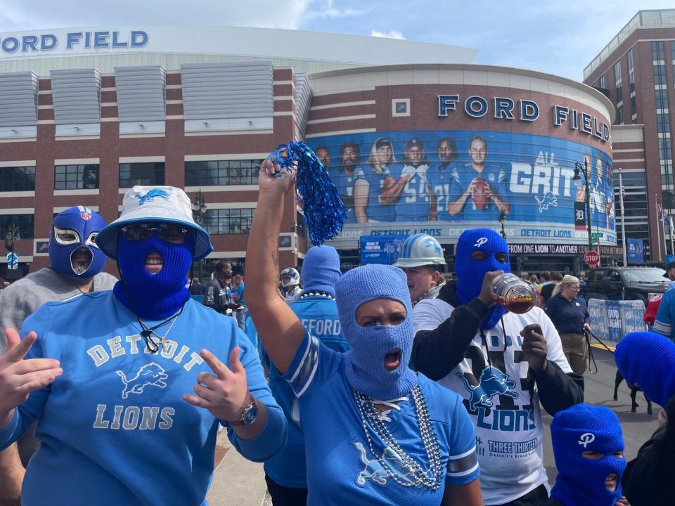 Detroit Lions fans wearing blue ski masks outside Ford Field before the home opener vs. the Seattle Seahawks, Sunday, Sept. 17, 2023 in Detroit.