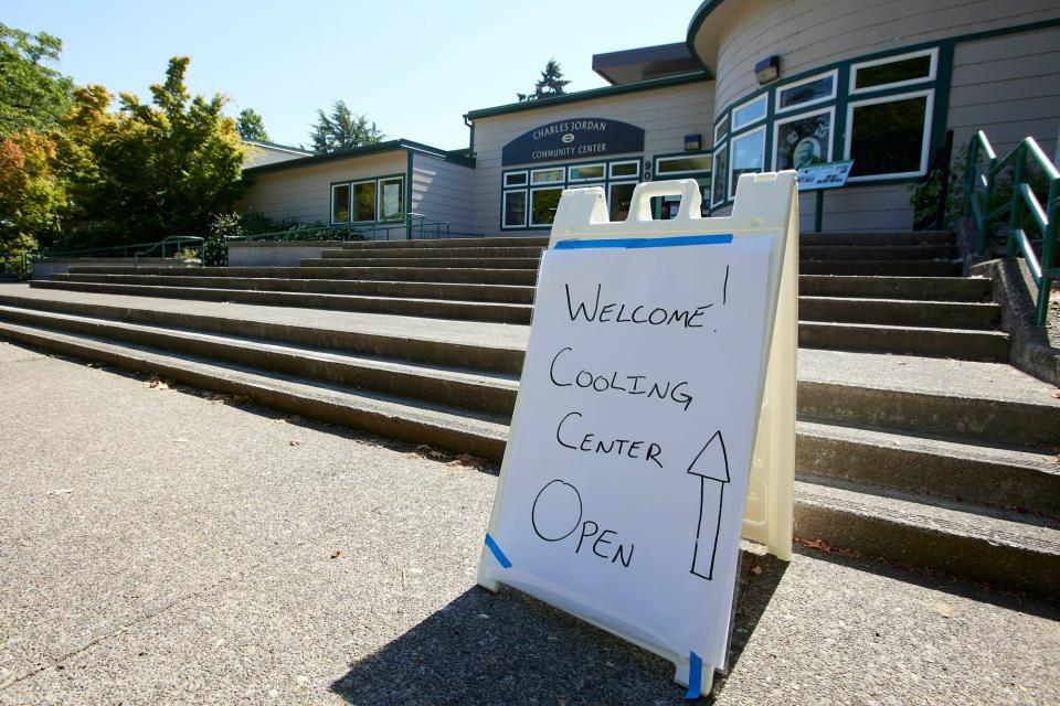 A sign showing that a cooling center at the Charles Jordan Community Center is open is shown in Portland, Ore., Tuesday, July 26, 2022. Temperatures are expected to top 100 degrees F (37.8 C) on Tuesday and wide swaths of western Oregon and Washington are predicted to be well above historic averages throughout the week.