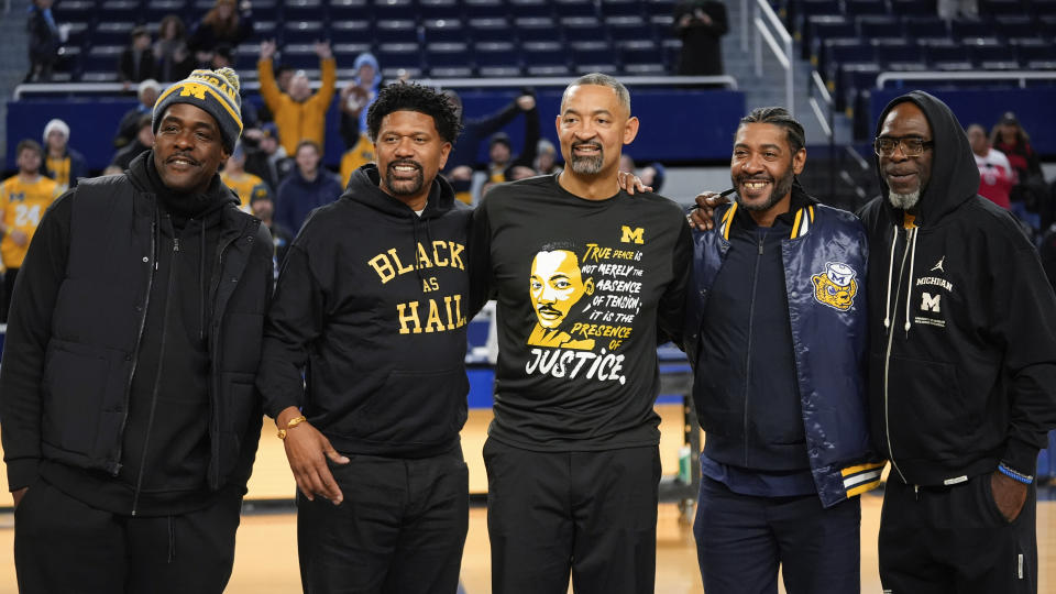 Former Michigan Fab Five basketball players Chris Webber, from left, Jalen Rose, Michigan head coach Juwan Howard, Jimmy King and Ray Jackson pose pose after an NCAA college basketball game against Ohio State in Ann Arbor, Mich., Monday, Jan. 15, 2024. (AP Photo/Paul Sancya)