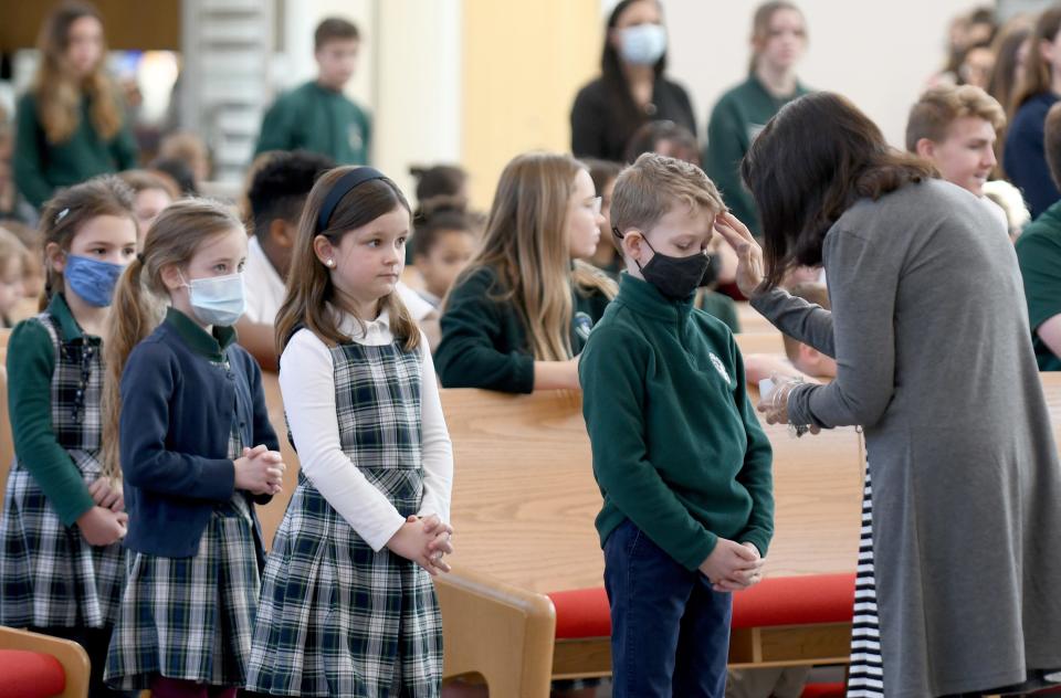 St. Michael the Archangel Catholic School students receive ashes during Ash Wednesday.