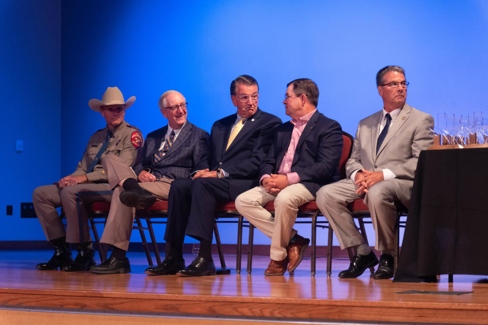 Walter Wendler, president of West Texas A&M University, speaks with state Reps. Ken King and John Smithee on Thursday at the Texans Caring for Texans award ceremony in Canyon.