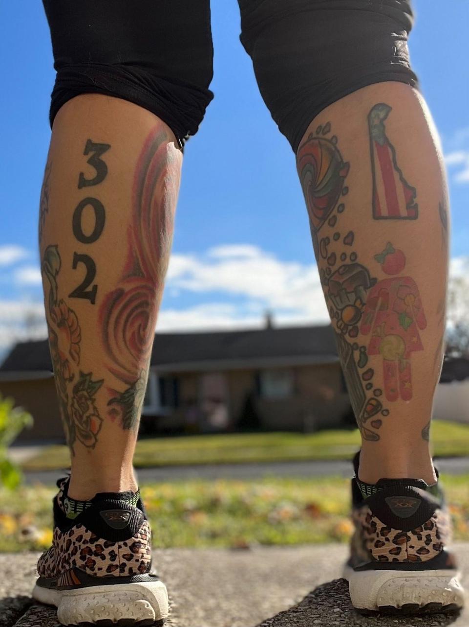 Beca Sanchez shows her Delaware pride with a tattoo on each leg.