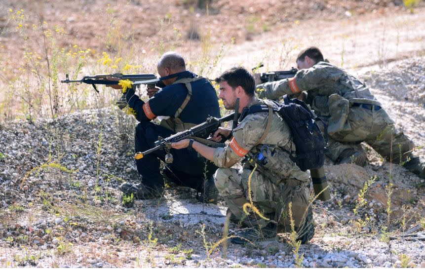 Special Forces candidates assigned to the U.S. Army John F. Kennedy Special Warfare Center and School react to gunfire as they take part in the final phase of field training known as Robin Sage in central North Carolina, September 28, 2021. (U.S. Army photo by K. Kassens)