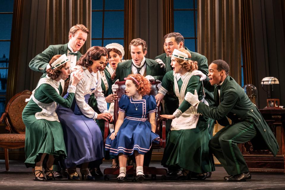 Ellie Pulsifer, center, as Annie and Company in the National Tour of "Annie."