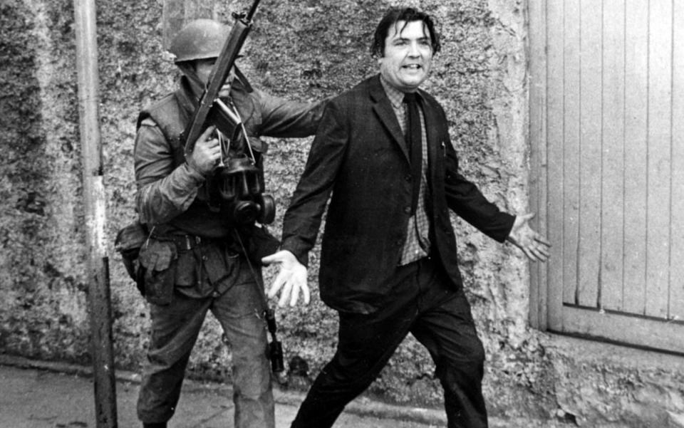 John Hume is detained by soldiers during a civil rights protest in Londonderry in August 1971 - Alan Lewis