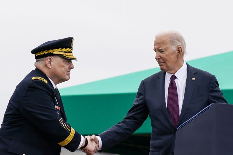 General Mark A. Milley shakes hands with President Joe Biden during a ceremony Friday at the Armed Forces Farewell Tribute in honor of General Mark A. Milley, 20th Chairman of the Joint Chiefs of Staff. Photo by Nathan Howard/UPI