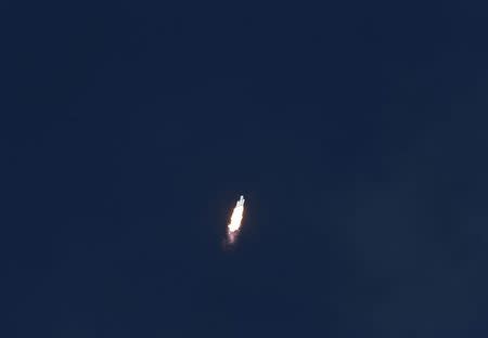 A SpaceX Falcon Heavy rocket climbs toward space after lifting off from historic launch pad 39-A at the Kennedy Space Center in Cape Canaveral, Florida, U.S., February 6, 2018. REUTERS/Joe Skipper