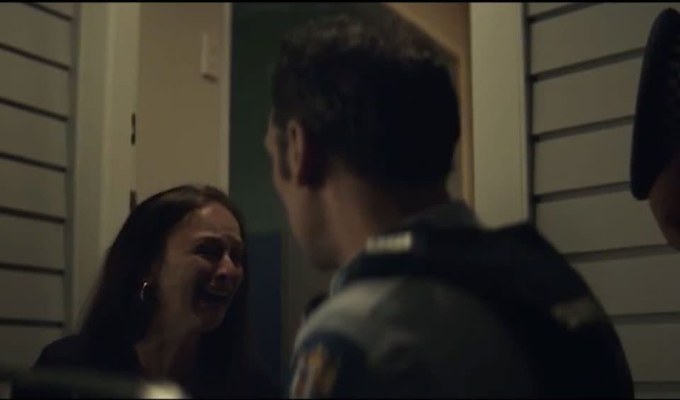 An officer has to tell someone their loved one is dead in the poignant ad. Source: YouTube.