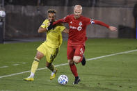 Nashville SC's Hany Mukhtar, left, and Toronto FC's Michael Bradley vie for control of the ball during the first half of an MLS soccer playoff match Tuesday, Nov. 24, 2020, in East Hartford, Conn. (AP Photo/Jessica Hill)