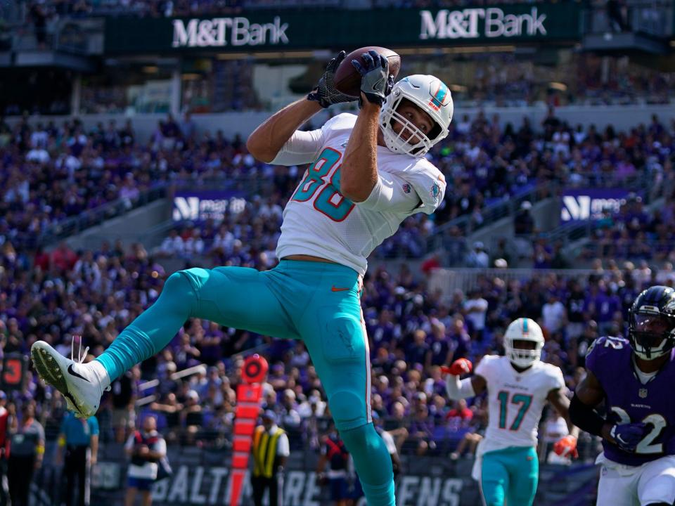 Mike Gesicki scores a touchdown against the Baltimore Ravens.