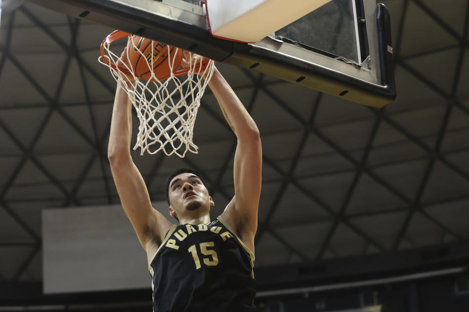 Purdue center Zach Edey slam dunks the ball over Marquette during the first half of an NCAA college basketball game, Wednesday, Nov. 22, 2023, in Honolulu. (AP Photo/Marco Garcia)