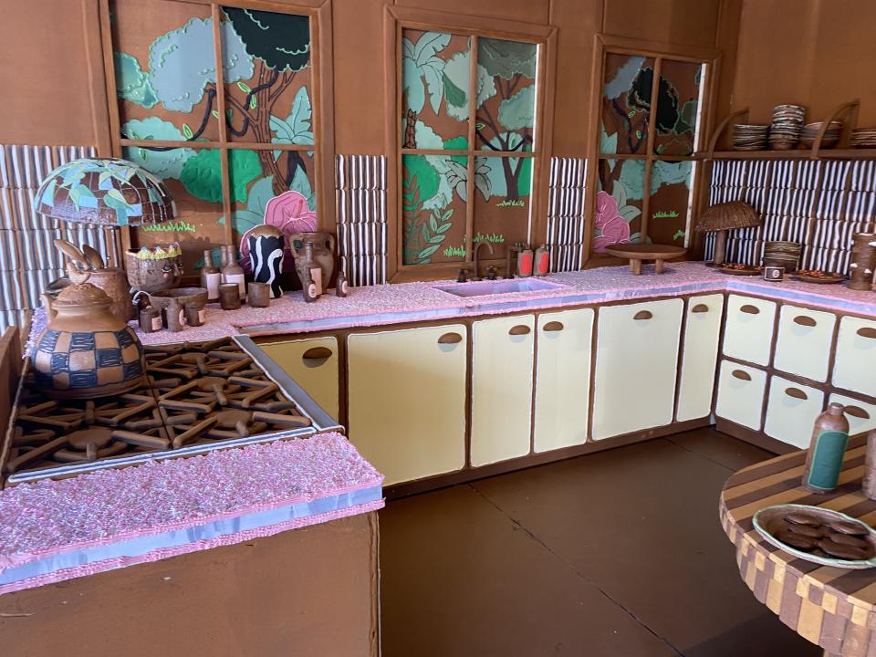 Lots of sprinkles top the gingerbread countertops inside the holiday house kitchen. Photo by Deborah Belgum.