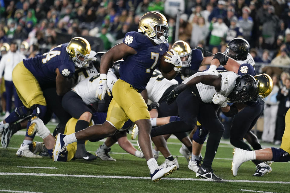 Notre Dame running back Audric Estime (7) runs in for a touchdown against Wake Forest during the second half of an NCAA college football game in South Bend, Ind., Saturday, Nov. 18, 2023. (AP Photo/Michael Conroy)