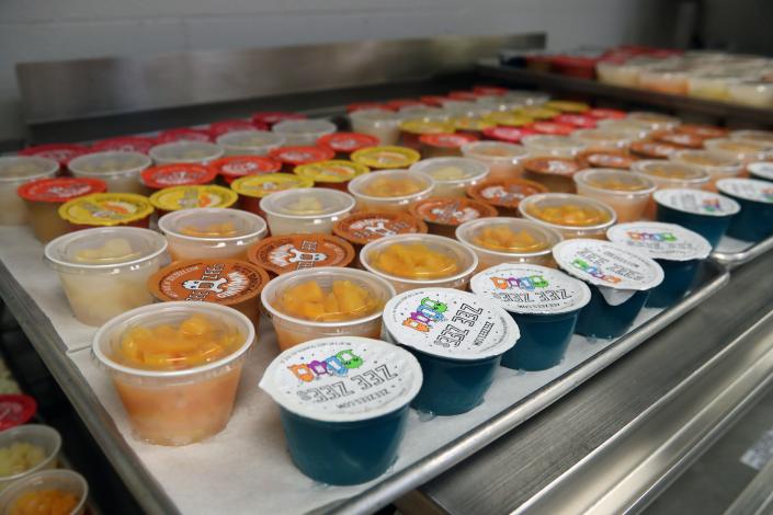 Rows of fruit cups and other snacks for student lunches are shown in the kitchen at Grove City High School on Jan. 19.
