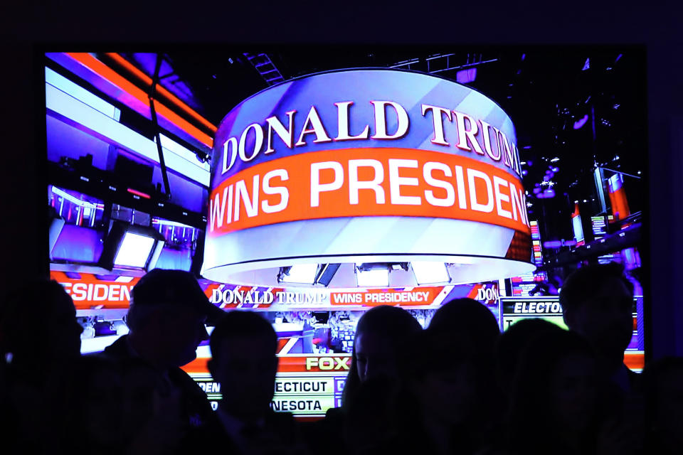 People celebrate during the call for Republican president-elect Donald Trump at his election night event at the New York Hilton Midtown in New York City, on Nov. 9.