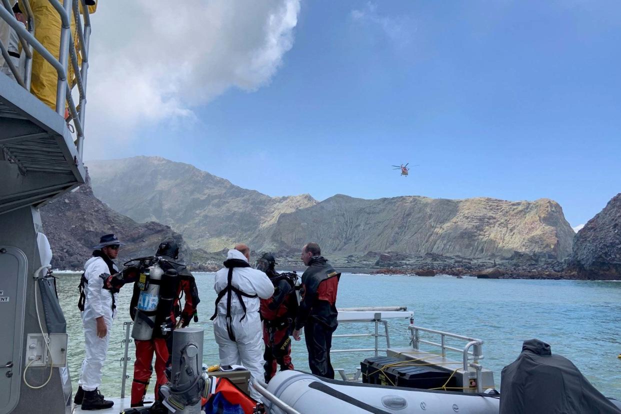 Members of a dive squad conduct a search during a recovery operation around White Island: NEW ZEALAND POLICE via REUTERS