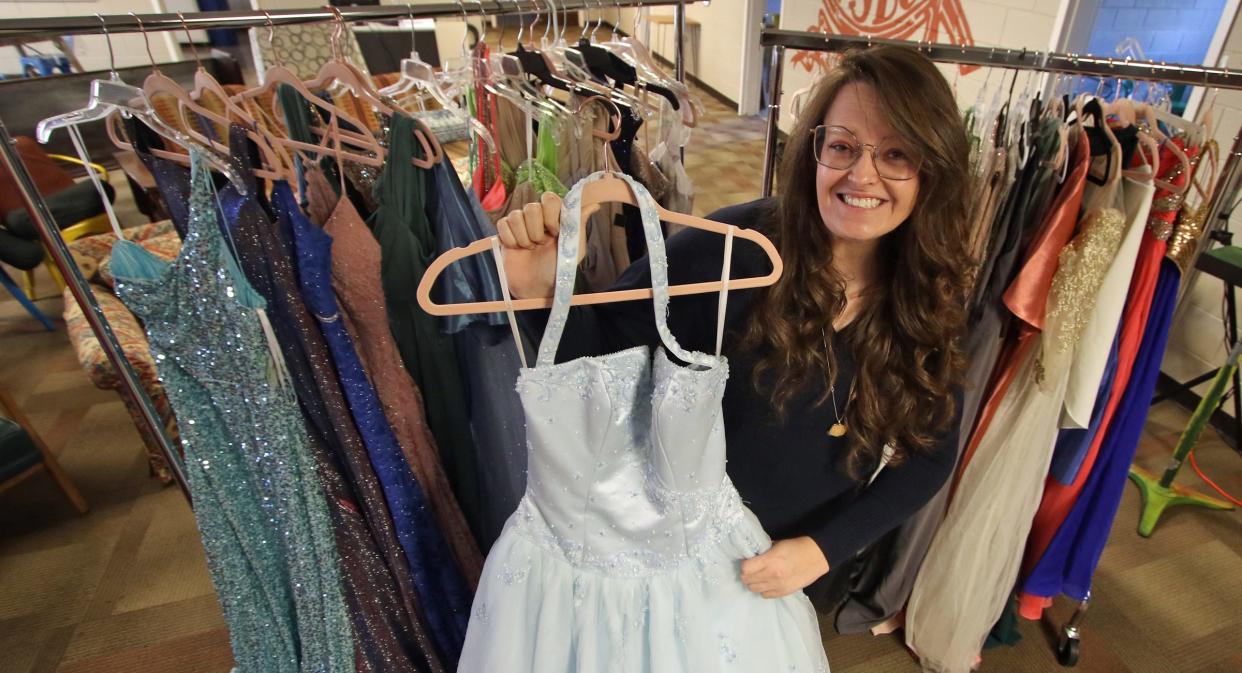 Heather Wright shows off one of the hundreds of prom dresses at Pamela's Closet, a chapter of the national organization Becca's Closet, at Poplar Springs Baptist Church near Shelby Monday morning, Jan. 23, 2023.