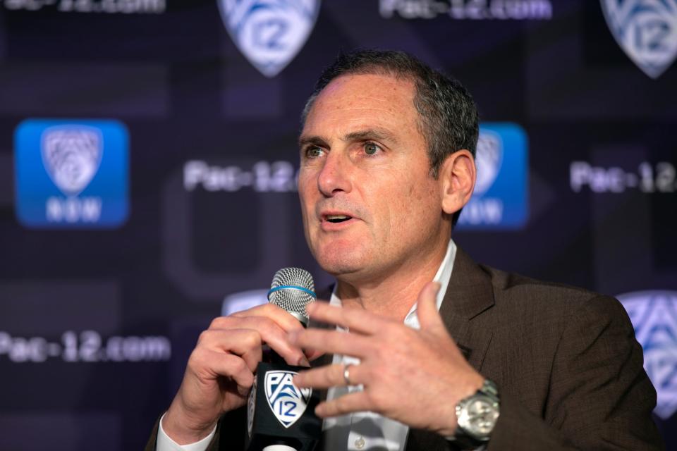 Then-Pac-12 Commissioner Larry Scott speaks to reporters during the Pac-12 Conference women's college basketball media day in San Francisco, in this Monday, Oct. 7, 2019, file photo.
