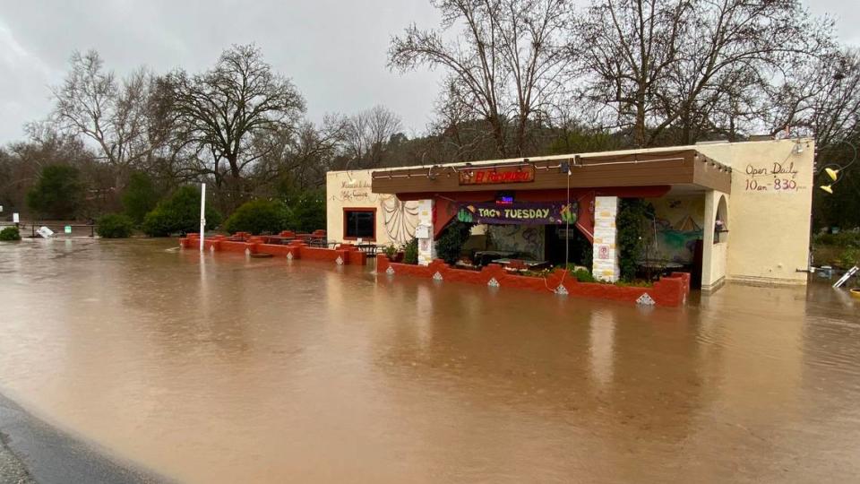 Atascadero Creek overflowed its banks, flooding the neary by El Taconazo restaurant at Highway 41 and Portola Road on Jan. 9, 2023.