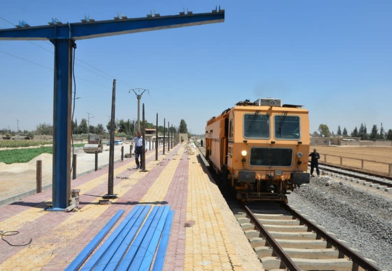 Syrian railroad workers and technicians work on the restoration of the railway in the Syrian capital Damascus. The government views reviving the railways as crucial to its reconstruction policy