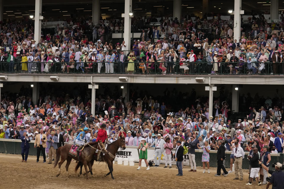 Javier Castellano celebrates after riding Mage to win the 149th running of the Kentucky Derby horse race at Churchill Downs Saturday, May 6, 2023, in Louisville, Ky. (AP Photo/Jeff Roberson)