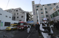 <p>Police investigators leave after inspecting a hospital after a fire in Miryang, South Korea, Friday, Jan. 26, 2018. (Photo: Ahn Young-joon/AP) </p>