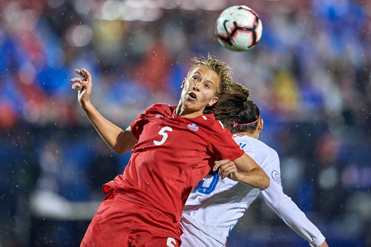 Image: Rebecca Quinn battles for the ball during the final match of the CONCACAF Women's Championship between USA and Canada on Oct. 17, 2018 in Frisco, Texas. (Robin Alam / Icon Sportswire via Getty Images)