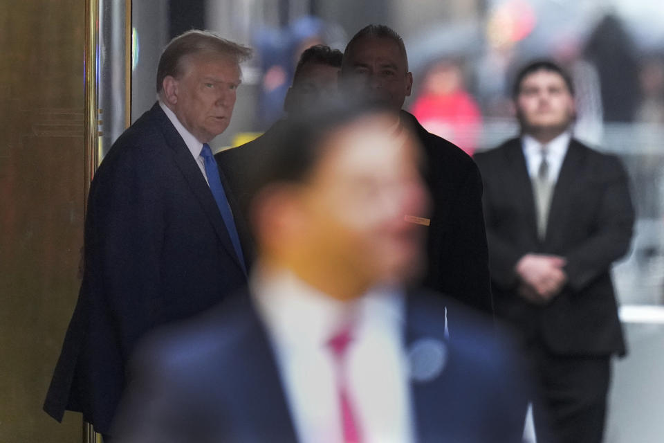 Former president Donald Trump leaves Trump Tower on his way to Manhattan criminal court, Thursday, April 18, 2024, in New York. Jury selection in Donald Trump's hush money trial enters a pivotal phase as the former president returns to court. Attorneys still need to pick 11 more jurors to serve on the panel that will decide the first-ever criminal case against a former U.S. commander-in-chief. (AP Photo/Seth Wenig)