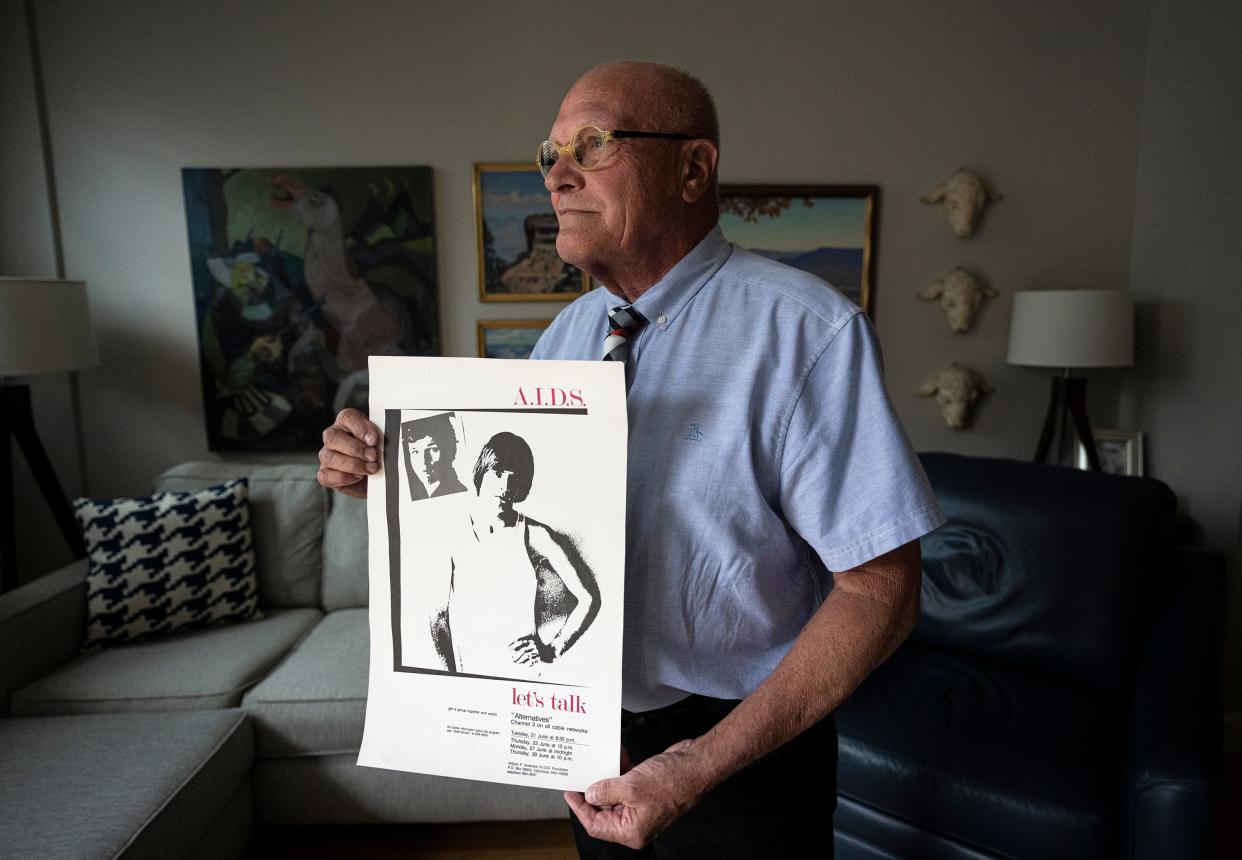 Steve Shellabarger holds a poster he created in 1988 to raise awareness about AIDS in the Columbus community. More than 40 years after the HIV/AIDS epidemic landed in Ohio, Shellabarger continues to be an advocate for LGBTQ rights.