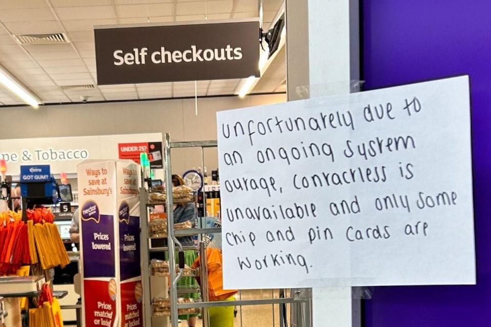 A notice informing customers of technical issues at a Sainsbury’s in Huddersfield (PA Wire)