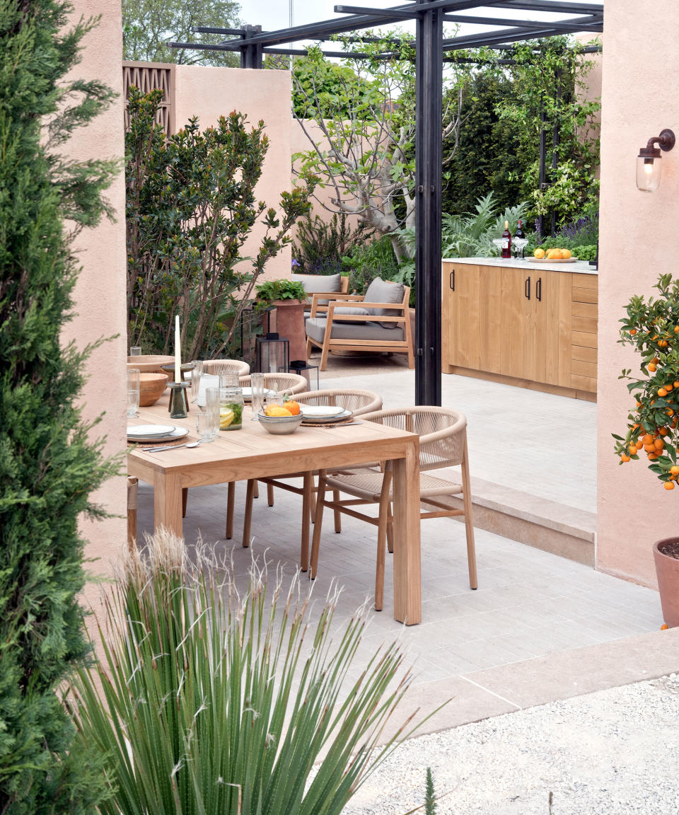 patio with outdoor dining area, pergola and outdoor kitchen