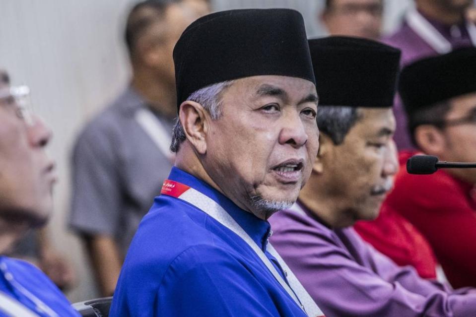 Umno president Datuk Seri Ahmad Zahid Hamidi (center) speaks to the media at the press conference during the Umno's general assembly (PAU 2022) at World Trade Centre Kuala Lumpur January 14, 2023. — Picture by Hari Anggara