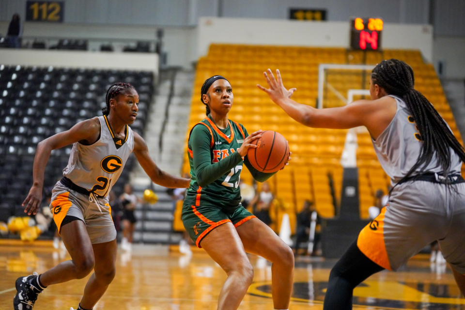 Florida A&M University women's basketball Dylan Horton (with ball) splits Grambling State defenders Jurnee McLaurin and Amanda Blake to attempt a jumpshot at Fredrick C. Hobdy Assembly Center, Grambling, Louisiana, Monday, Jan. 9, 2023